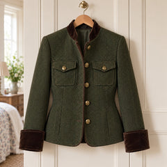 The Bernadette Herringbone Tailored Jacket with Velvet Trim in Olive on a hanger
