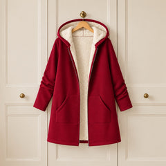 The Carla Fleece Lined Hooded Longline Coat on a hanger