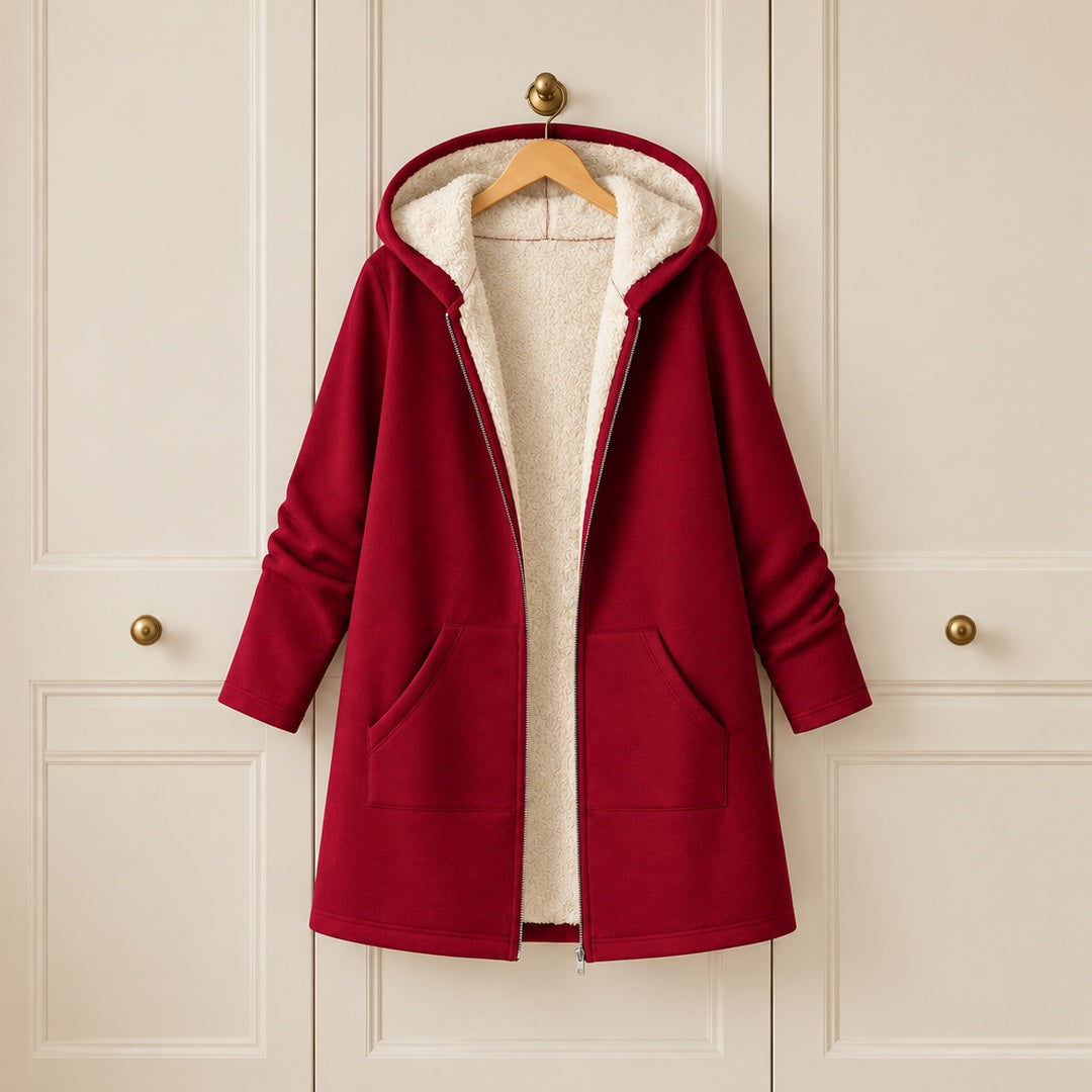 The Carla Fleece Lined Hooded Longline Coat on a hanger