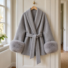 The Dianne Belted Wrap Coat with Faux Fur Cuffs in Grey on a hanger