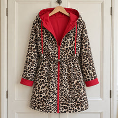 The Donna Reversible Leopard Print Hooded Coat on a hanger