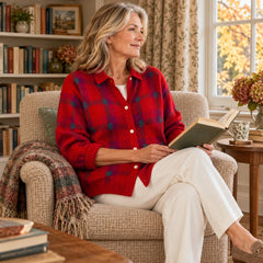 A woman wearing the Elspeth Heritage Check Collared Knit Cardigan in Red
