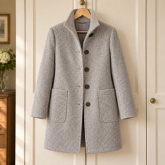 Eunice Classic Stand Collar Button Coat in Grey on a hanger