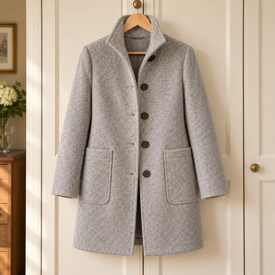 Eunice Classic Stand Collar Button Coat in Grey on a hanger