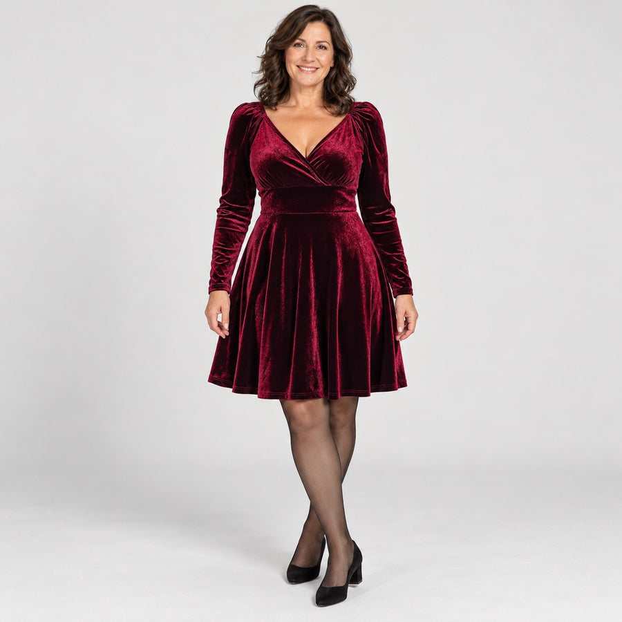 The Gemma Velvet Wrap V-Neck Long Sleeve Dress in the studio