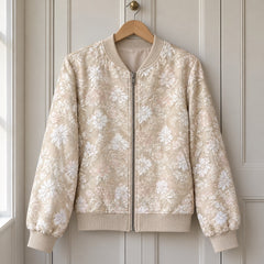 The Hayley Floral Jacquard Bomber Jacket on a hanger