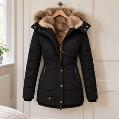 The Heather Padded Winter Coat with Fur-Look Hood in Black on a hanger
