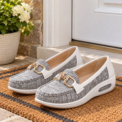 Jackie Gold Buckle Comfort Loafers on a doormat