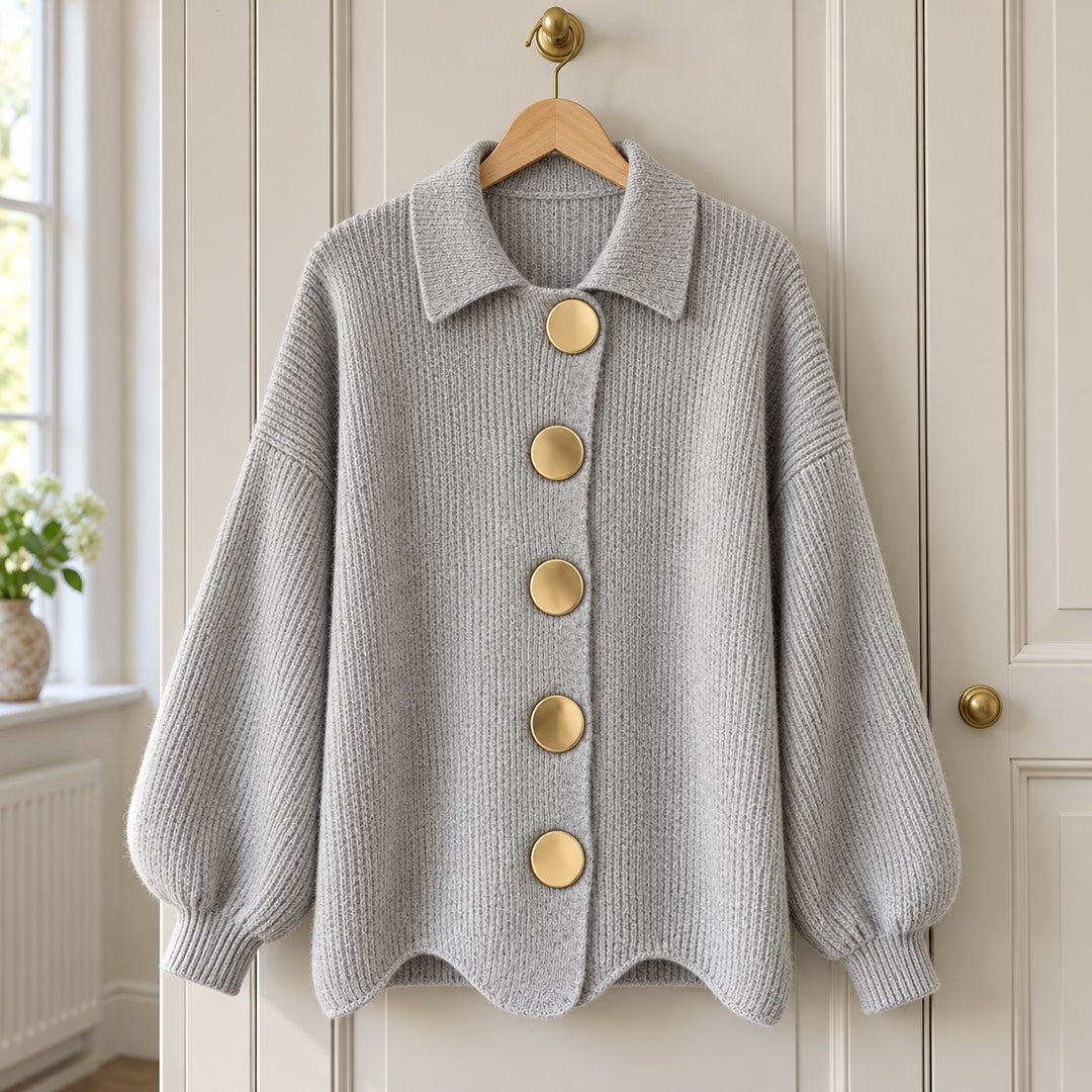 The Jacqueline Collared Gold Button Knit Cardigan in Grey on a hanger