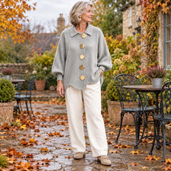 A woman wearing the Jacqueline Collared Gold Button Knit Cardigan in Grey