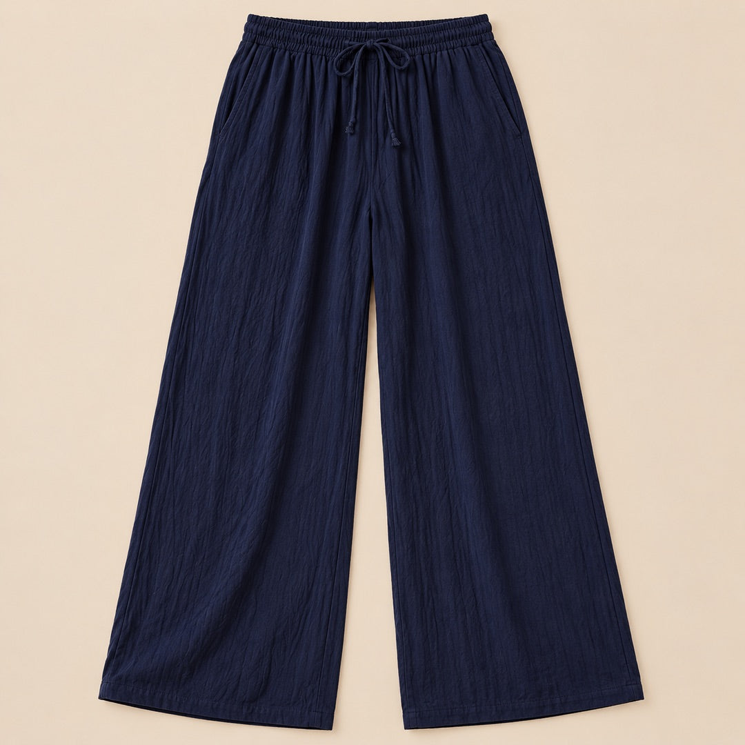 Jan Relaxed Wide-Leg Drawstring Trousers in Navy, the whole piece laid flat