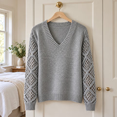 The Jeanette Open-Knit Sleeve V-Neck Jumper in Grey on a hanger