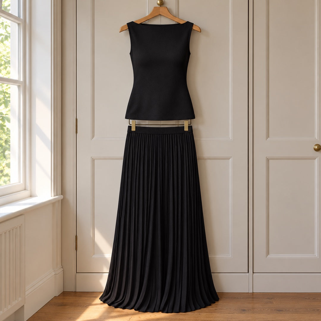 The Jenny Boat Neck Knit Top and Pleated Maxi Skirt Set on a hanger