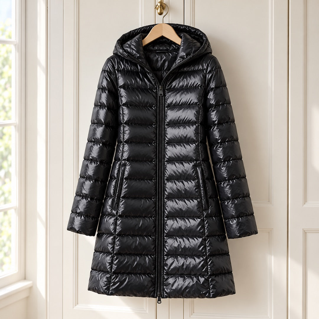 The Karen Lightweight Longline Down Coat with Hood in Black on a hanger