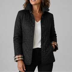 A woman wearing the Lesley Diamond Quilted Button Jacket in Black
