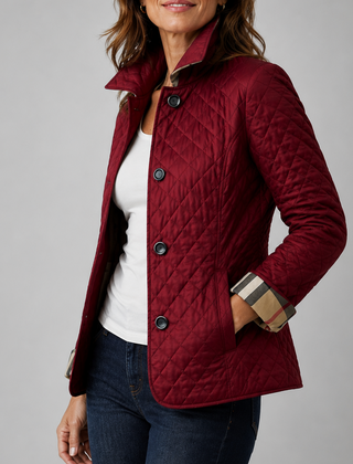 A woman wearing the Lesley Diamond Quilted Button Jacket in Burgundy