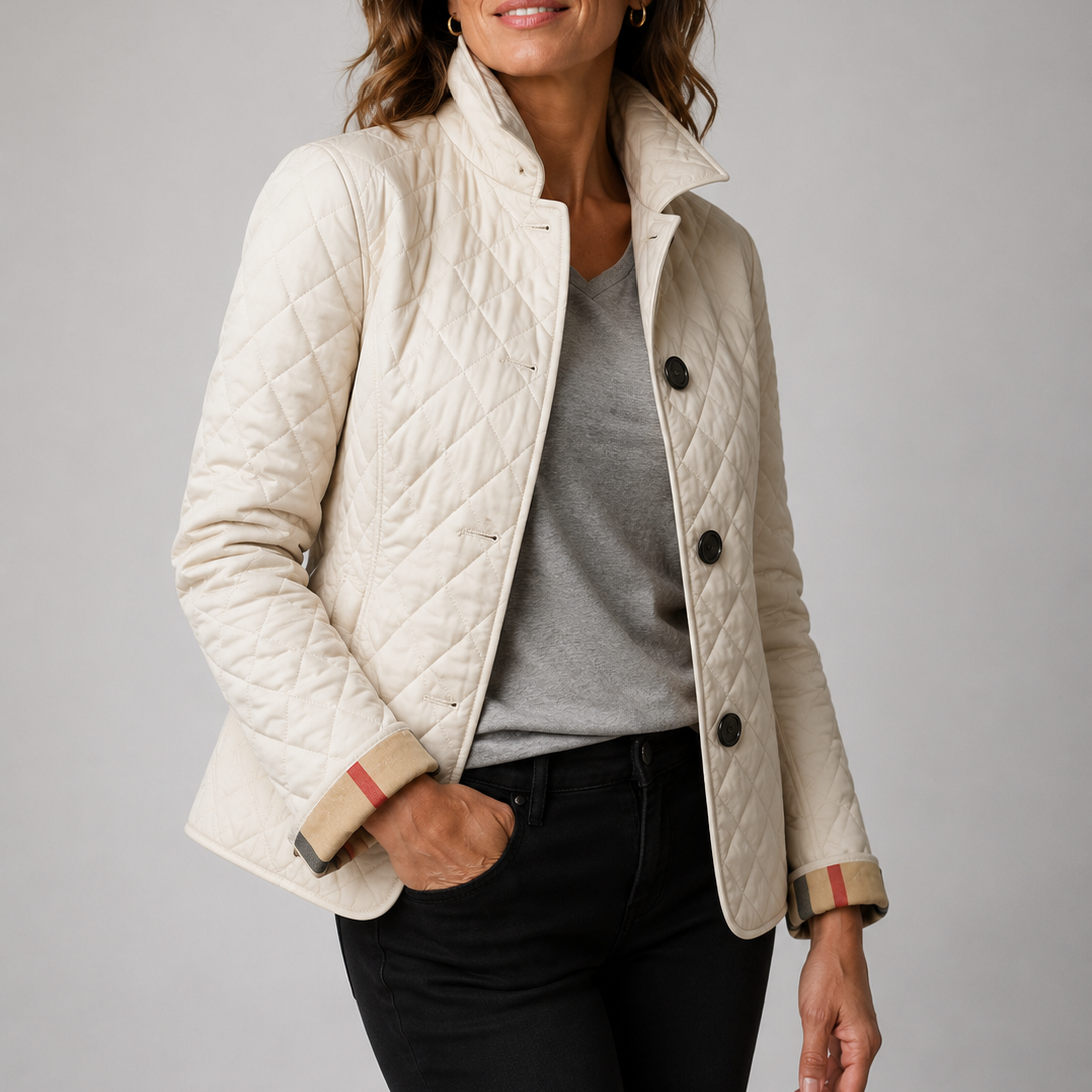 A woman wearing the Lesley Diamond Quilted Button Jacket in Cream