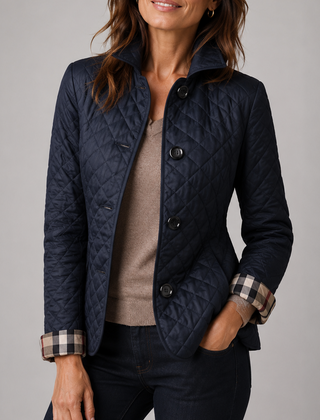 A woman wearing the Lesley Diamond Quilted Button Jacket in Navy