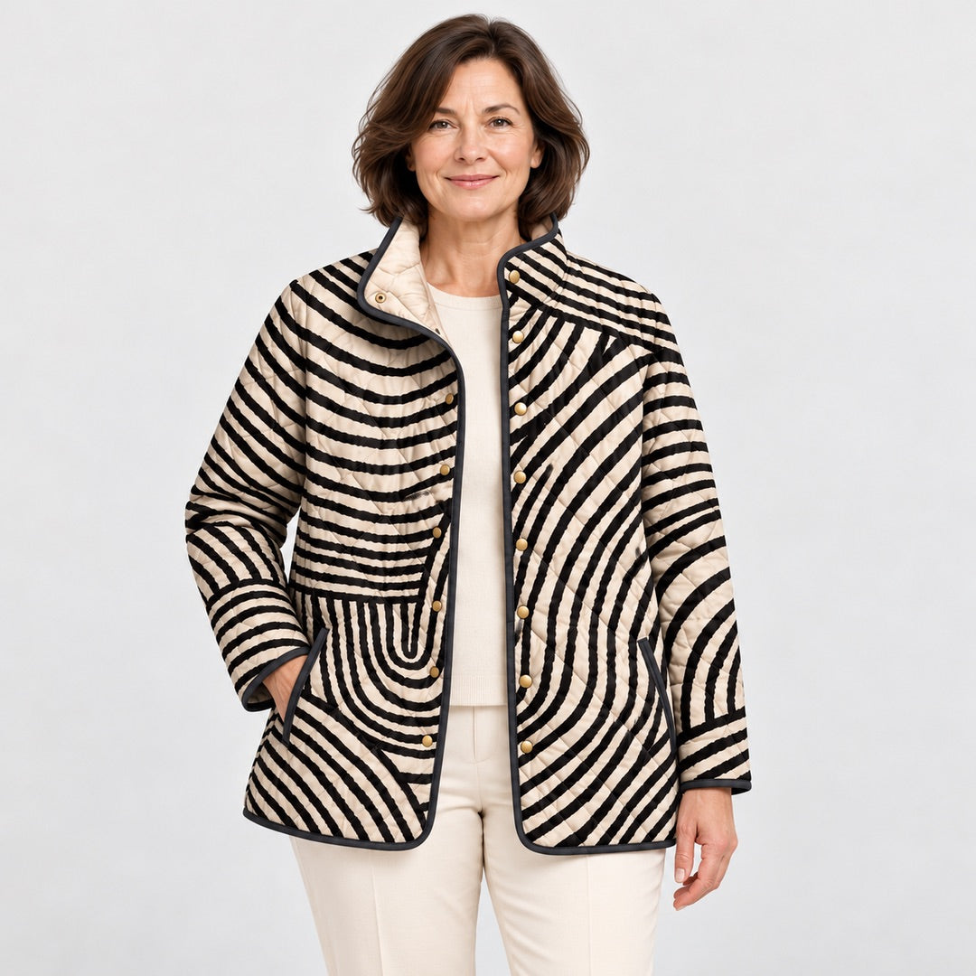Close-up of the Lisa Swirl Print Quilted Stand Collar Jacket in Black Cream Swirl