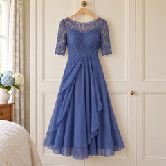 The Lynette Lace Bodice Tiered Chiffon Midi Dress in Blue on a hanger