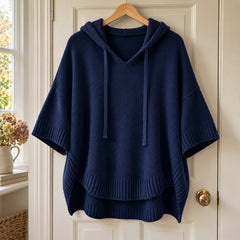 Maggie Hooded Knit Poncho Jumper in Navy on a hanger