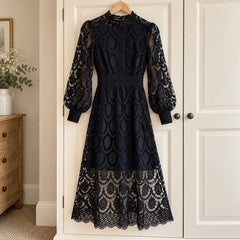 Marlene High Neck Lace Dress with Balloon Sleeves in Black on a hanger