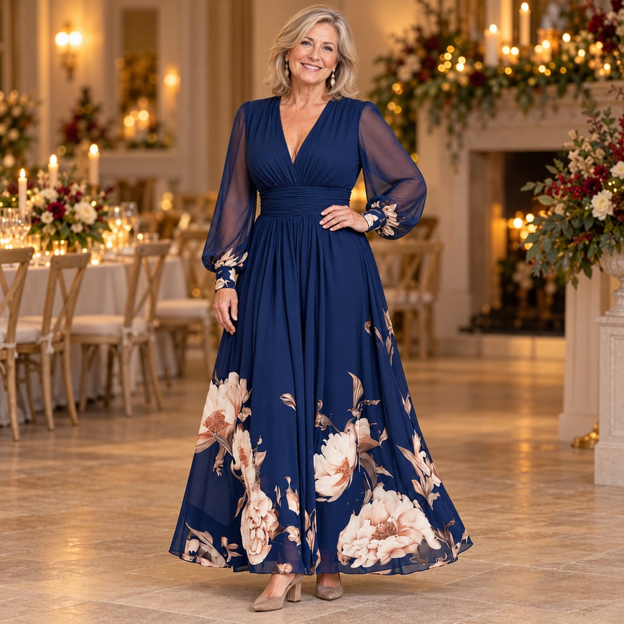 A woman wearing the Michelle Floral Hem Sheer Sleeve Maxi Dress in Navy