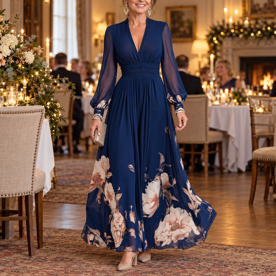 A woman wearing the Michelle Floral Hem Sheer Sleeve Maxi Dress in Navy
