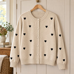 Peggy Heart Pattern Knit Cardigan in Oatmeal on a hanger