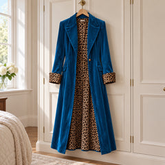 The Rosalind Long Velvet-Look Coat with Leopard Print Lining in Petrol Blue on a hanger