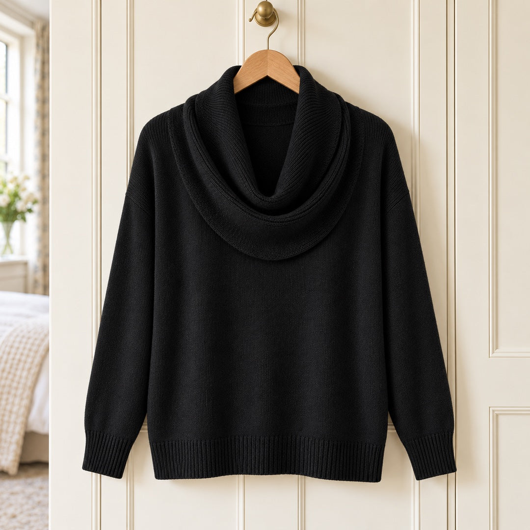 The Ruth Soft Cowl Neck Knit Jumper in Black on a hanger