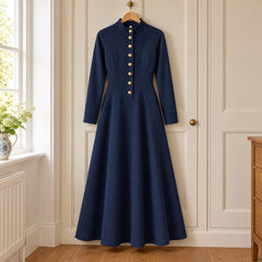 The Sandie Stand Collar Button Maxi Dress in Navy on a hanger