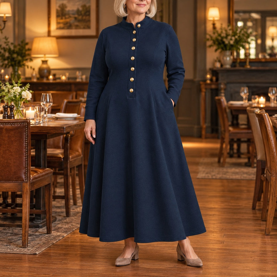 A woman wearing the Sandie Stand Collar Button Maxi Dress in Navy